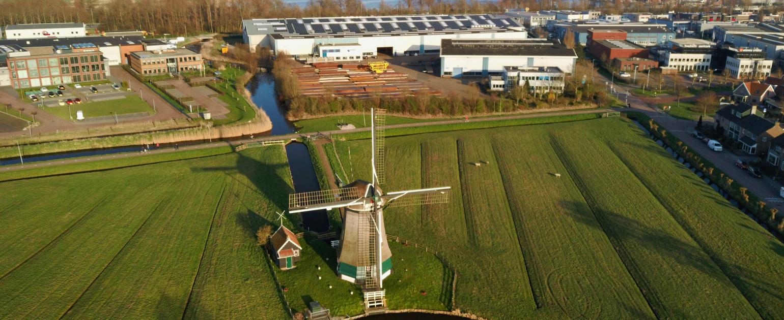 ROTO aerial view of windmill in a field