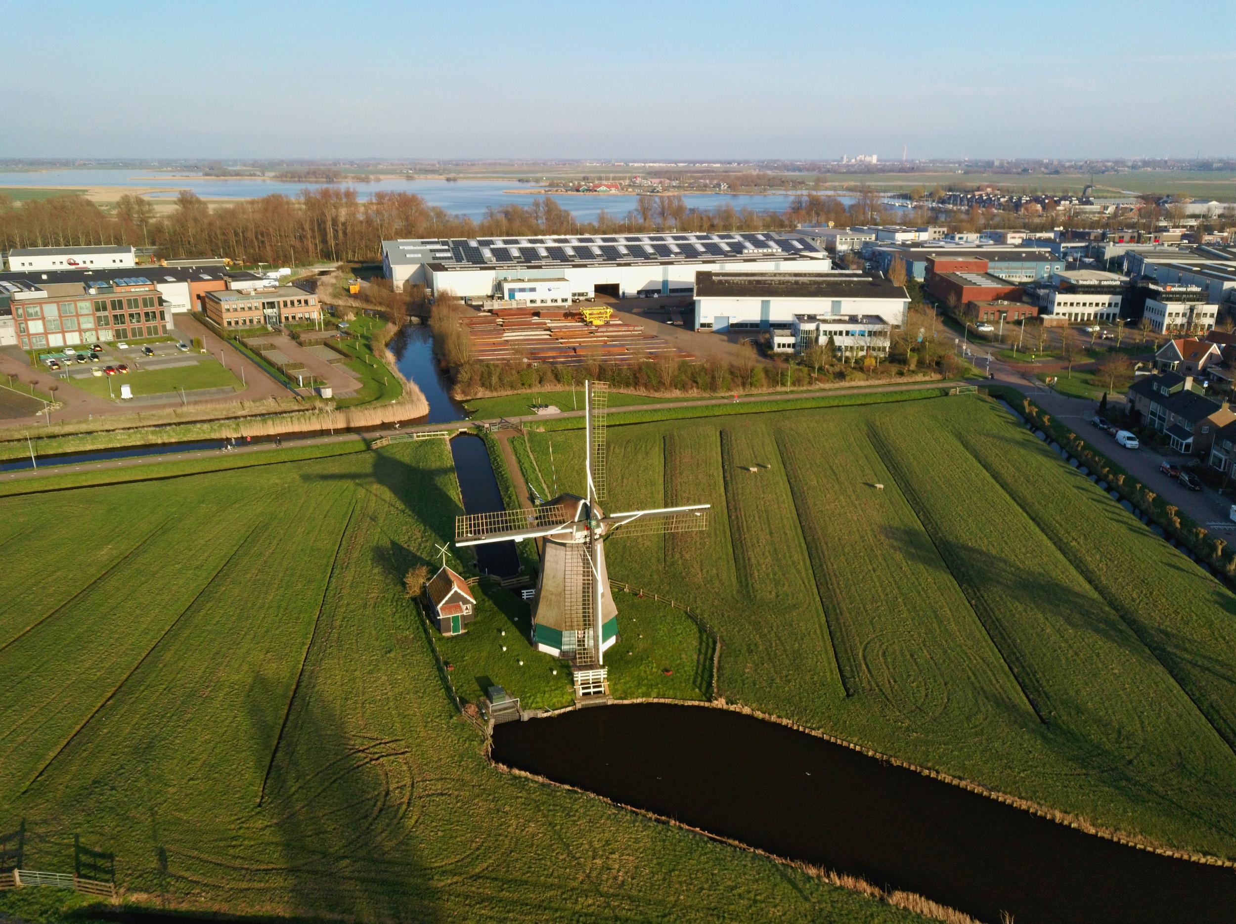 ROTO aerial view of windmill in a field