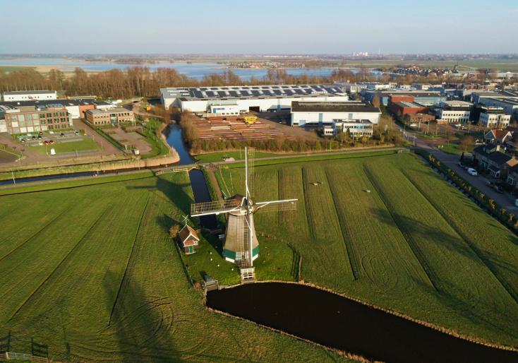 ROTO aerial view of windmill in a field